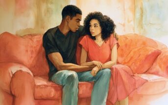 A man and woman sit close together on a red couch, looking into each other’s eyes with serious expressions. The woman wears a pink dress, and the man wears a black shirt and jeans. They hold hands in a comforting gesture.
