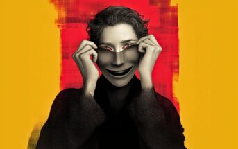 A person in black clothing pulls a smiling mask over their face, revealing only their eyes. The background is a mix of red and yellow with bold, textured brushstrokes. The image has a surreal, dramatic tone.